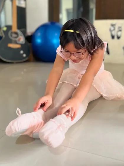A young ballerina learns basic positions and stretches. My kids' ballet classes are designed to introduce the fundamentals of ballet in a gentle and encouraging way.