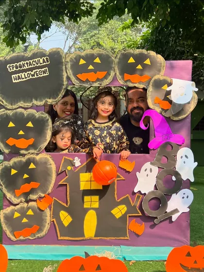 A happy family of four posing at our Halloween photo booth. It was a day of costumes, creativity, and spooky fun for everyone.