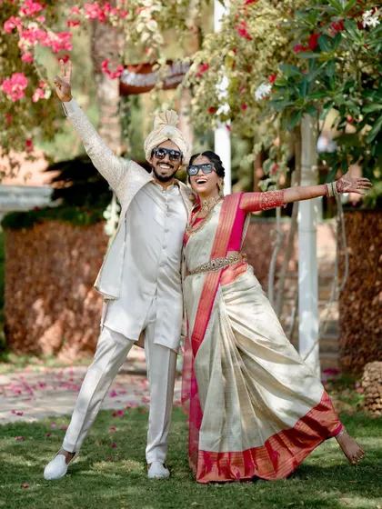 A fun and joyful shot of the happy couple, celebrating their big day in style.
