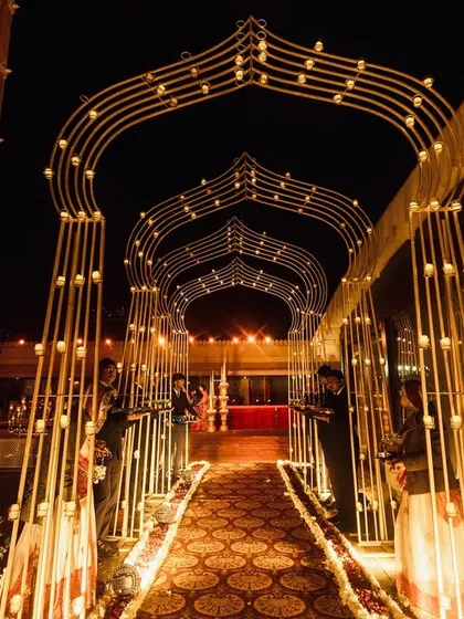 The illuminated arched walkway at Jagmandir, a signature element of the grand weddings I plan, creating a spectacular photo opportunity and a memorable experience.