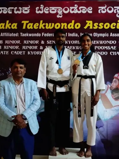 I am proud to stand with another one of our champions at the state-level Poomsae championship. Her gold medal is a testament to her precision and dedication.
