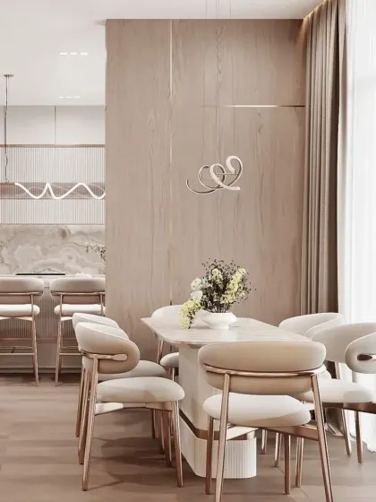An integrated living and dining space with a consistent design language. The light wood tones and neutral palette create a harmonious and calming atmosphere throughout the home.