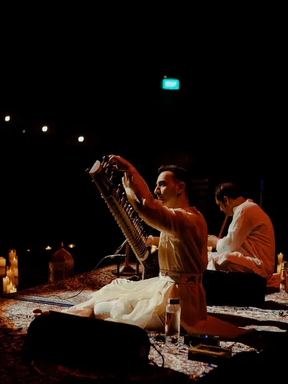 A moment of interaction with my instrument during a quiet, candlelit performance.