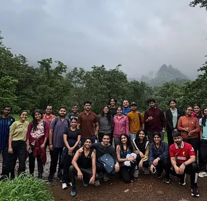 The full group ready to take on the misty trails of the Kalu Waterfall trek. The weather adds to the thrill of the adventure.