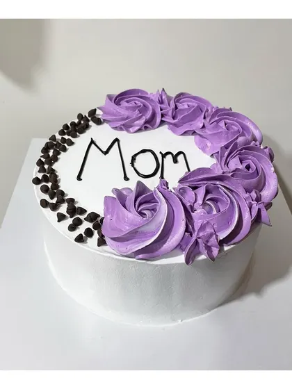 A beautiful choco-chip cake for Mom, decorated with purple roses.