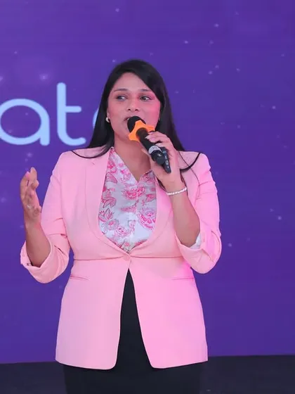 Another shot of me speaking at the AccelHERate conference, an event focused on empowering women in their careers. I am passionate about hosting events with a strong social purpose.