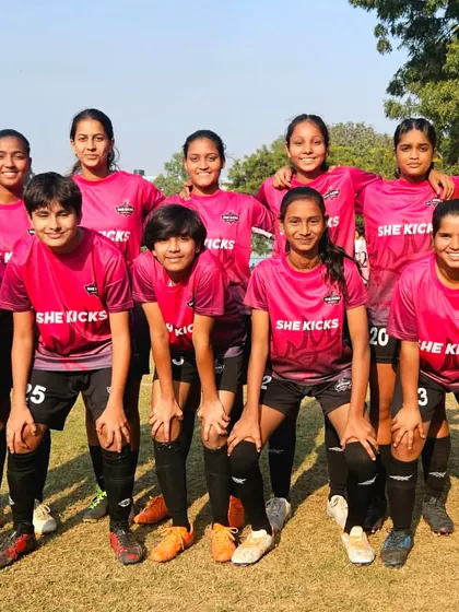 The She Kicks FA team poses before their match against us. We respect all our opponents and look forward to a competitive game.