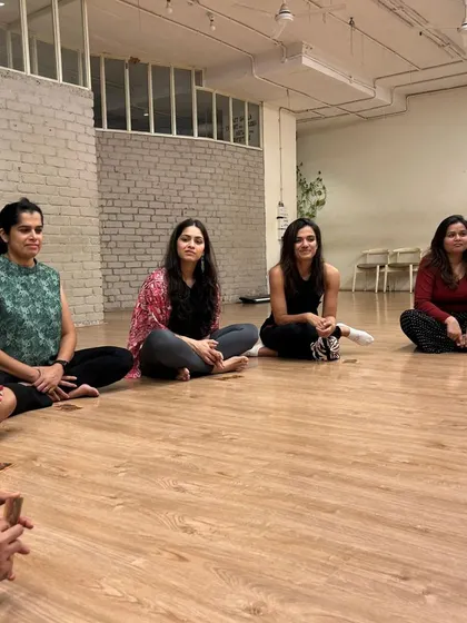 Women gather for our full moon circle, a space for connection and empowerment. We believe in the power of sisterhood and shared stories.