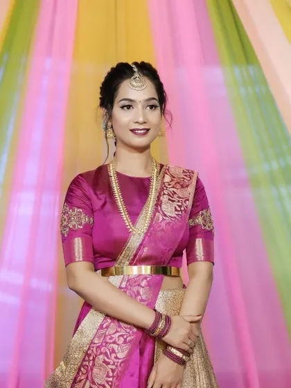 A beautiful portrait of a happy client for her event. The colorful background matches her joyful expression.