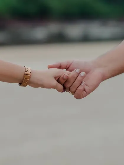 A close-up of the couple holding hands. This simple gesture, captured during their pre-wedding shoot, speaks volumes about their bond and the journey they are on together.