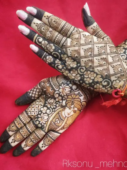 A stunning bridal design featuring a portrait on one hand and a dense, traditional pattern on the other. The back of the hands are covered in a beautiful geometric jaal pattern.