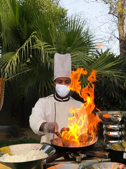 The drama of live cooking adds an unforgettable element to any event. Our chefs, trained in the art of culinary performance, bring the heat and energy of a live tandoor or wok station to your guests.