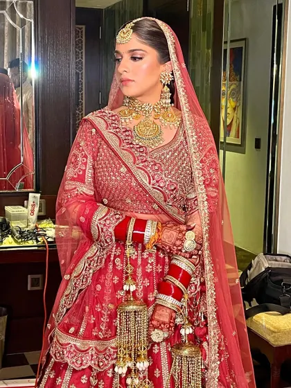 The bride looks fresh and radiant for her morning wedding, her hair neatly braided and styled.