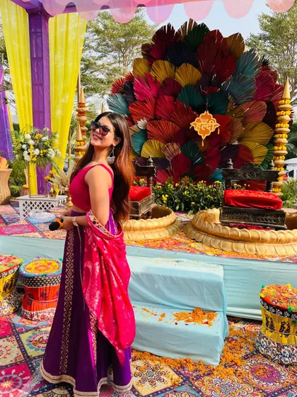 Posing with the mic before the Haldi function begins. The calm before the storm of fun and games.
