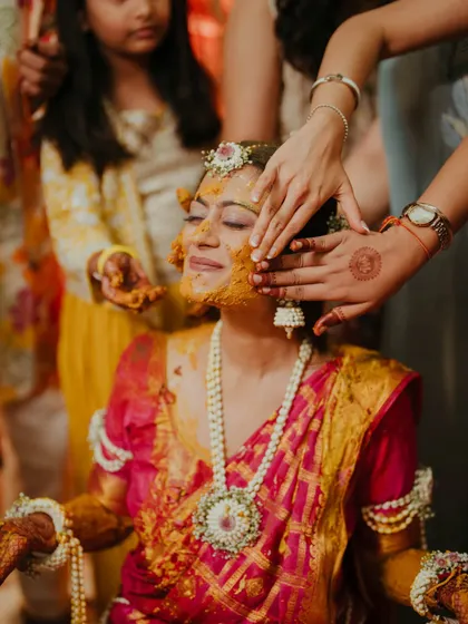 The bride glows as she is blessed with haldi by her loved ones. We manage the event flow so you can soak in these precious, candid moments without a worry.
