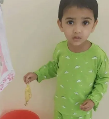 Another shot of a child practicing responsible waste disposal.