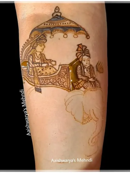 The initial sketch of the elephant procession on the arm, showing how a complex design is planned before filling.