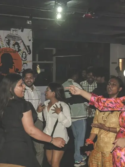 The party is in full swing with everyone on the dance floor. The energy is high and the music is loud.