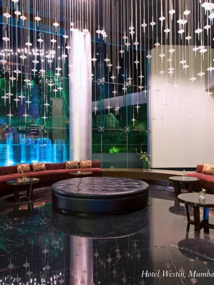 The lobby of Hotel Westin, Mumbai, showcases modern luxury with its high ceilings and dramatic lighting. A great choice for a contemporary city wedding.