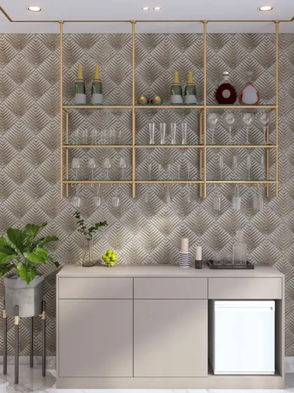A glamorous and minimalist bar area with a geometric-patterned wallpaper, floating gold-finish shelves for glasses, and a simple console with a built-in mini-fridge.