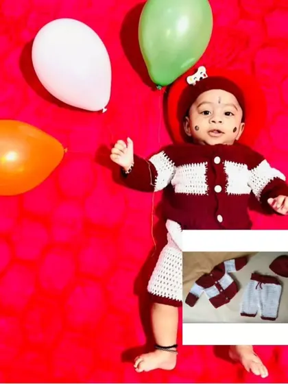 A complete three-piece set for a baby boy, featuring a button-up shirt, pants, and a matching cap in maroon and white. This client photo shows how dapper a little one can look in a full crochet suit.
