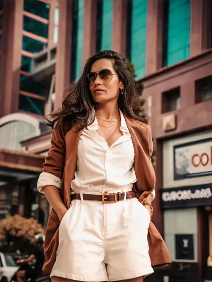 A powerful stance against a modern city backdrop. My persona is about being a queen in your dreams and a lady on the streets, ready to command any stage.