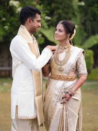 A beautiful couple portrait. The bride's makeup is timeless and radiant, designed to complement her partner's attire and create picture-perfect memories.