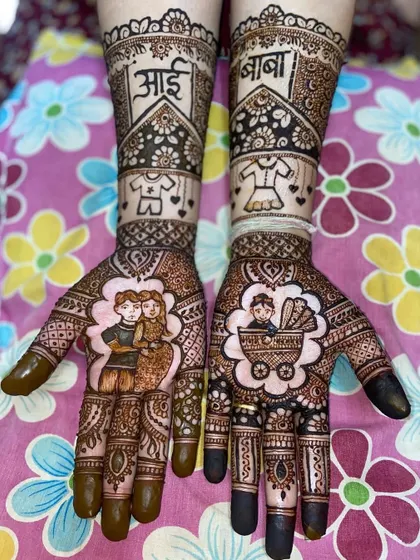 A lovely portrait mehandi for a baby shower, with the parents-to-be on one hand and a baby in a pram on the other, framed by floral patterns.
