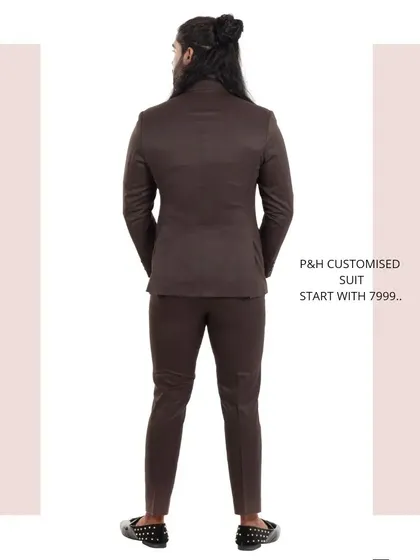 The back view of the brown suit, highlighting its classic construction.