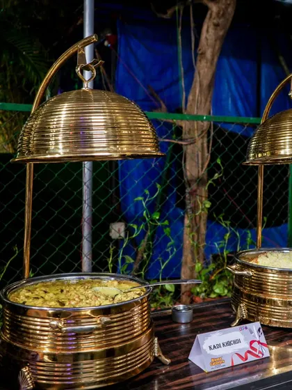 Our stunning brass serveware with elegant cloche lids, keeping the food warm while adding a touch of royalty to the buffet line.