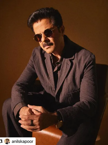 A close-up portrait of Anil Kapoor, where the lighting highlights the texture in his hair.