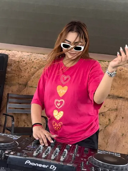 A candid, happy moment of me dancing and mixing at a daytime party.