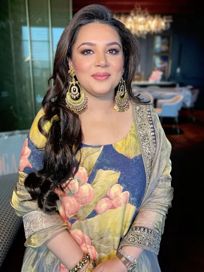 A close-up of the client, her beautiful earrings and soft makeup creating an elegant look.