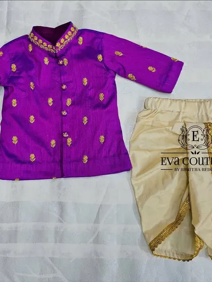 The matching boys' outfit for our newborn twin set. This features a purple raw silk kurta with gold butti embroidery and a comfortable cream-colored dhoti with a delicate gold border.
