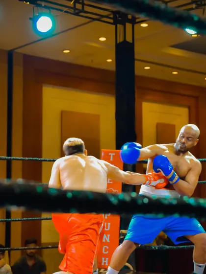 An action shot from a professional boxing match, showcasing high-level skill and power.