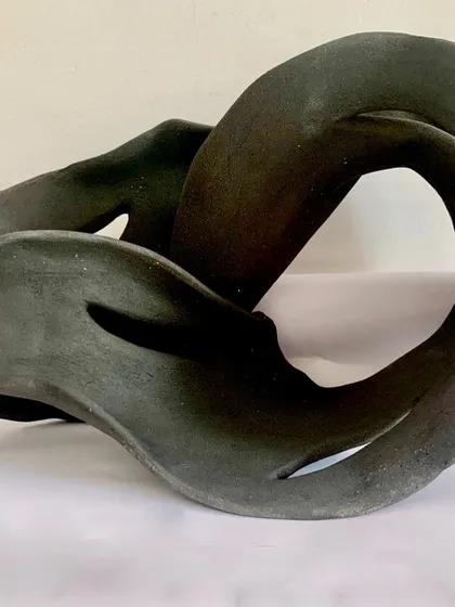 Another view of this hand-built abstract sculpture, showing how the form twists and turns. I love creating pieces that feel alive and full of energy.