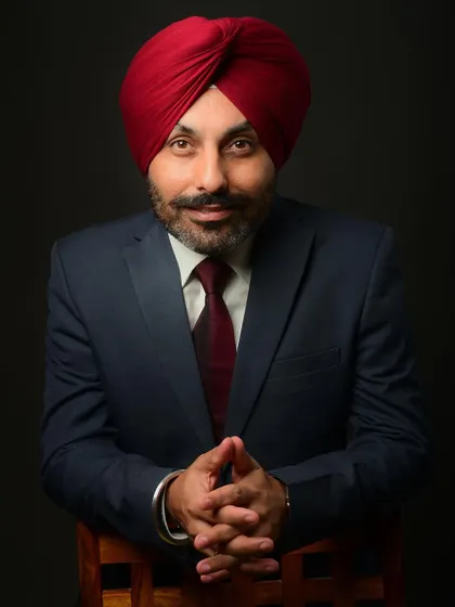 A classic head-and-shoulders portrait with the subject leaning forward. This creates an engaging and connected feel, perfect for a profile picture.