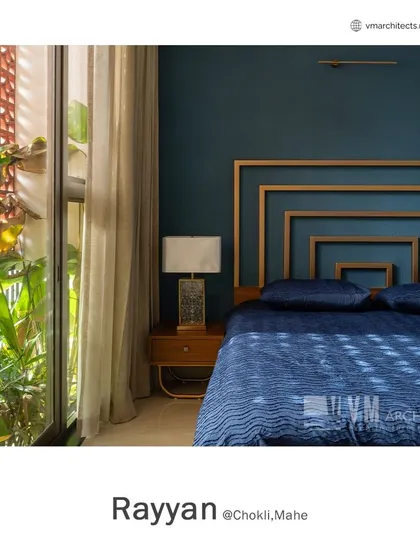 A closer view of the custom headboard and jali window in the Rayyan bedroom, showcasing the connection to the outdoor greenery.