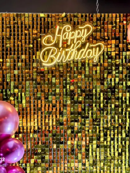 A 'Happy Birthday' neon sign against a shimmering gold sequin wall adds a touch of glamour to the Blackpink theme.