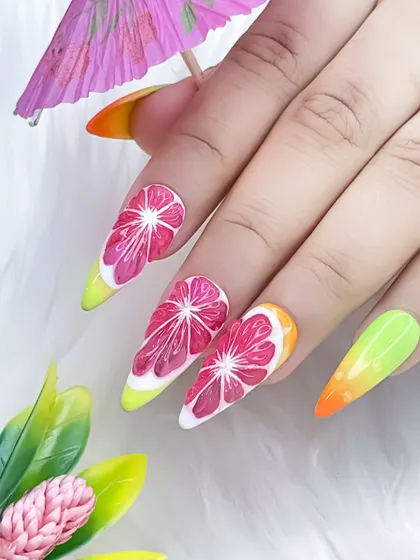 Juicy and realistic watermelon nail art. This design features a vibrant ombre base with hand-painted fruit slices, perfect for summer.