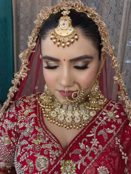 A close-up of the eye makeup. The golden glittery eyeshadow adds a touch of glamour to the traditional look.