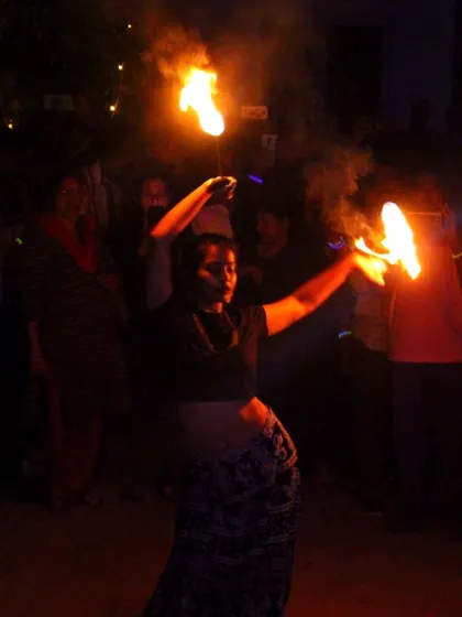 The mesmerizing performance of a fire dancer at a beach party, an entertainment option I can arrange to make your event unforgettable.