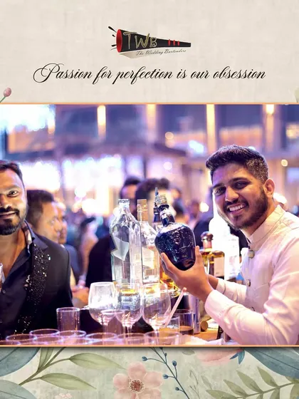 A guest and bartender share a moment at the bar, highlighting the interactive and engaging experience we strive to create.