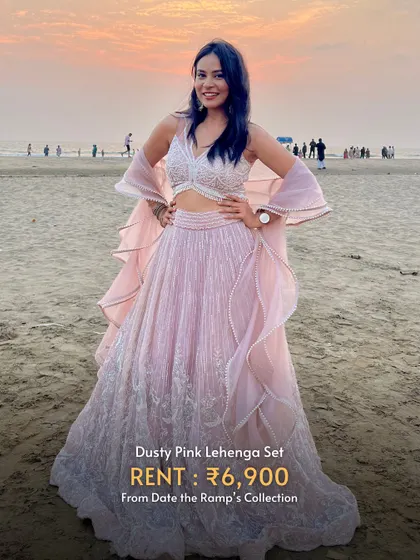 This dusty pink lehenga set looks absolutely dreamy for a beachside pre-wedding shoot.
