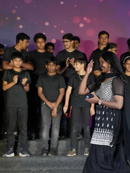 Interacting with my students on stage. I make sure every performer, no matter their age or skill level, feels seen and appreciated. This is key to a confident and happy group performance.