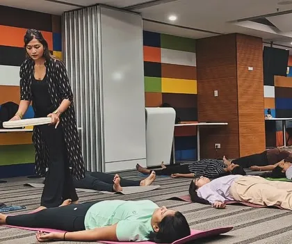 Walking through the room with a frame drum during a corporate session. The drum's rhythmic, grounding beat helps to anchor the participants' awareness in the present moment, quieting anxious thoughts.