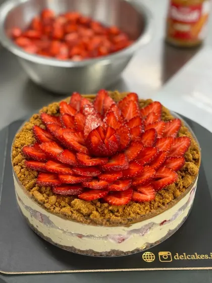 The final touch on our Fresh Strawberry Biscoff Cheesecake. The strawberries are arranged carefully by hand to create this beautiful floral pattern.