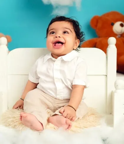 A big, happy laugh from this little one. These joyful, candid moments are what make milestone sessions so special.