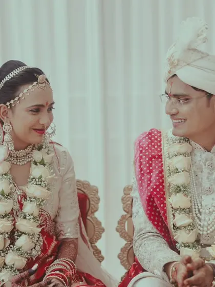 A duplicate of the couple sharing a sweet glance during their ceremony.