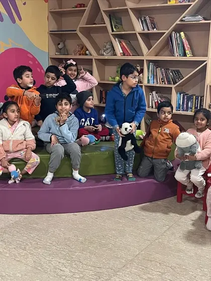 A cozy pajama party in full swing! All the kids gathered with their favorite stuffed animals for a night of stories and games.